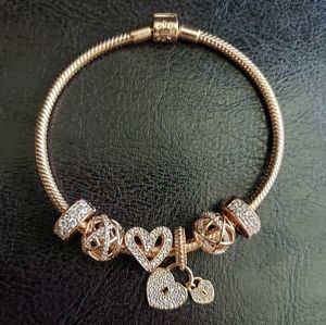 Authentic Pandora Rose Gold bracelet with charms